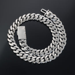 Coiled silver-tone Cuban necklace showing polished link backs and the open clasp