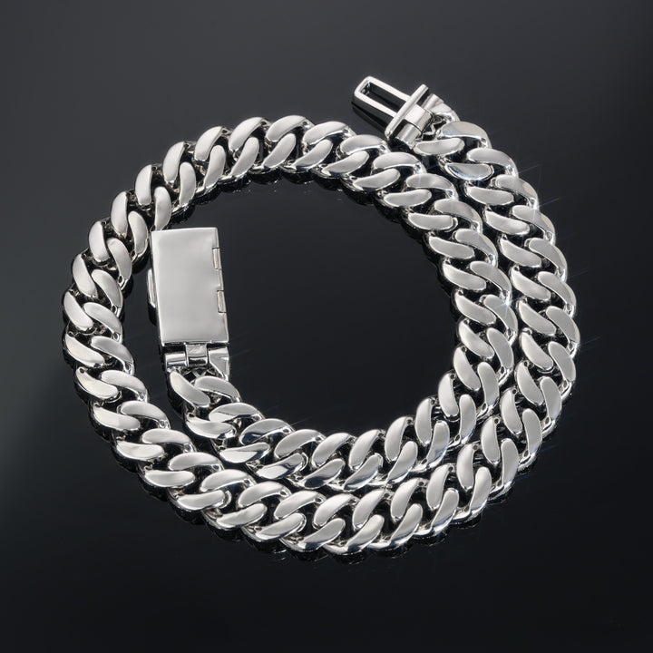 Coiled silver-tone Cuban necklace showing polished link backs and the open clasp