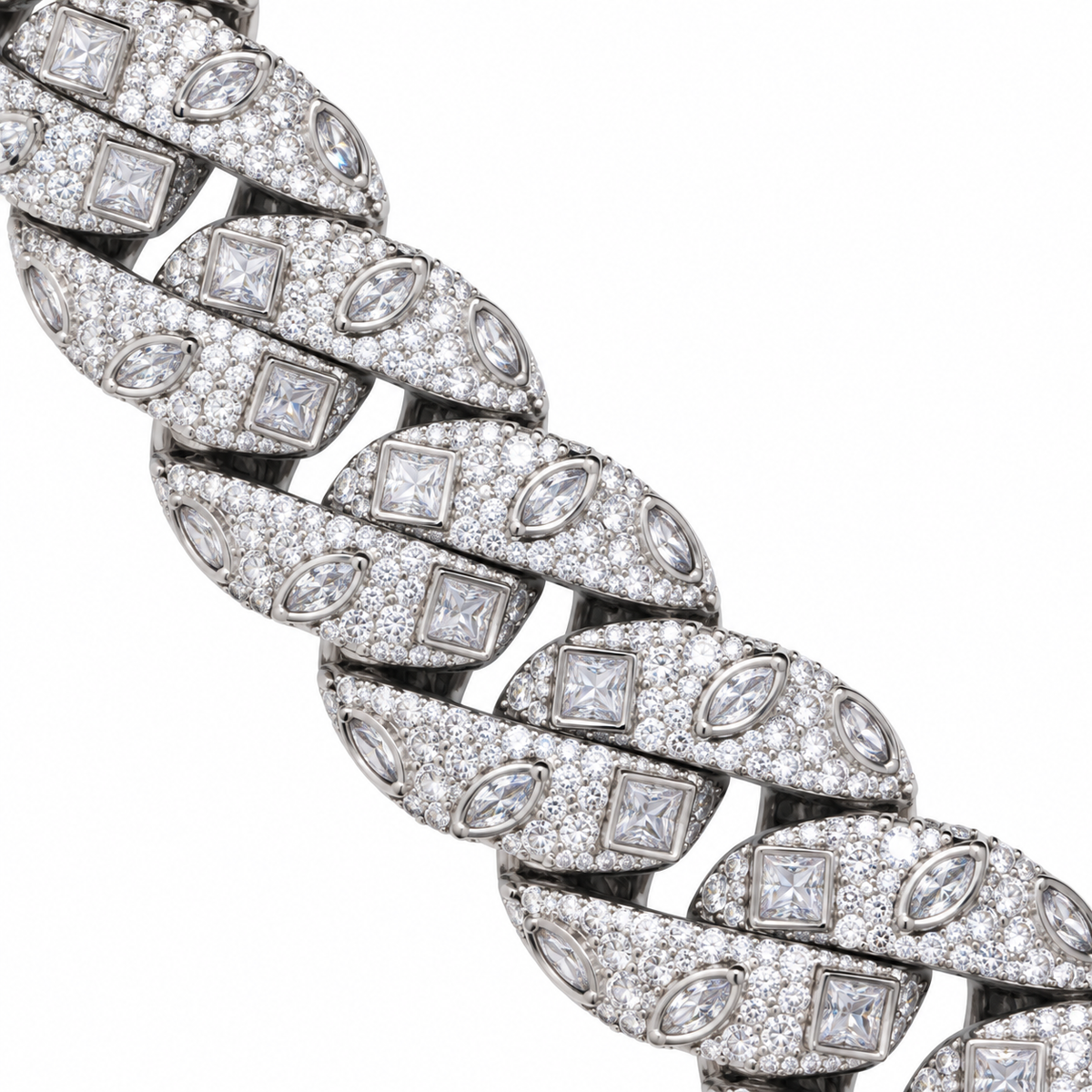 Close-up of silver-tone Cuban links with square and marquise accents on white