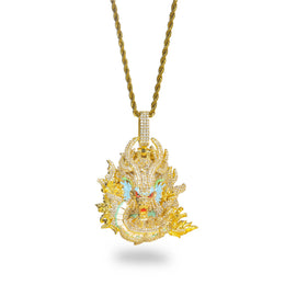 Gold iced dragon pendant displayed on white