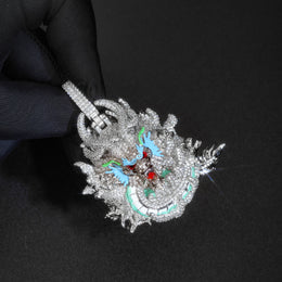 Silver iced dragon pendant held in a black glove