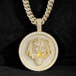 Gold-tone lion medallion pendant front view against black fabric