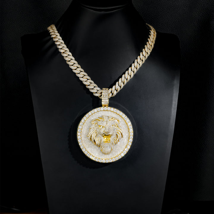 Gold-tone lion medallion pendant on a black display bust