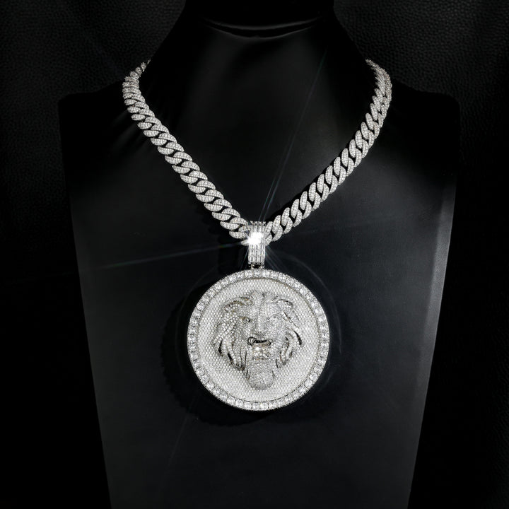Silver-tone lion medallion pendant on a black display bust