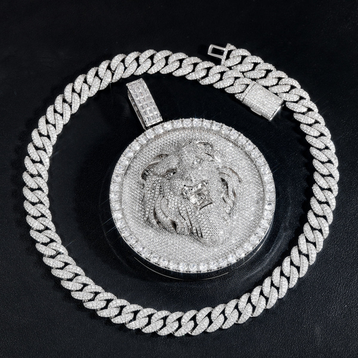 Silver-tone lion medallion pendant laid flat on black leather