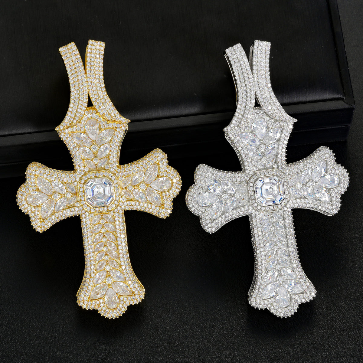 Gold and silver oversized iced cross pendants front view