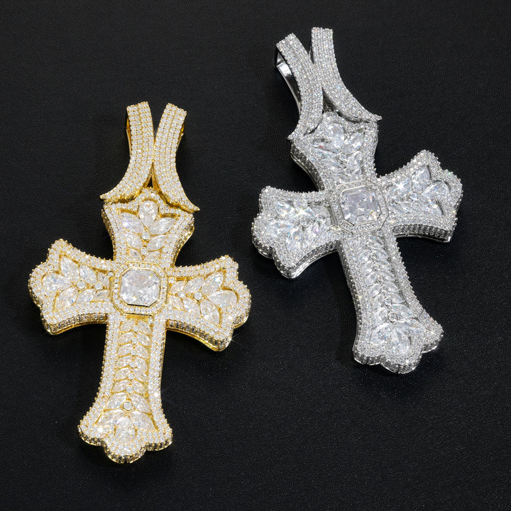 Gold and silver oversized iced cross pendants angled view