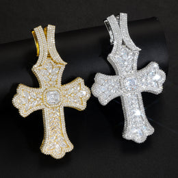 Gold and silver oversized iced cross pendants on black