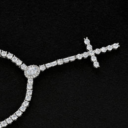 Slender silver-tone cross drop necklace with an oval halo and rectangular accents on black