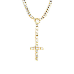 Gold-tone cross drop tennis necklace with an oval halo and rectangular stone accents on white
