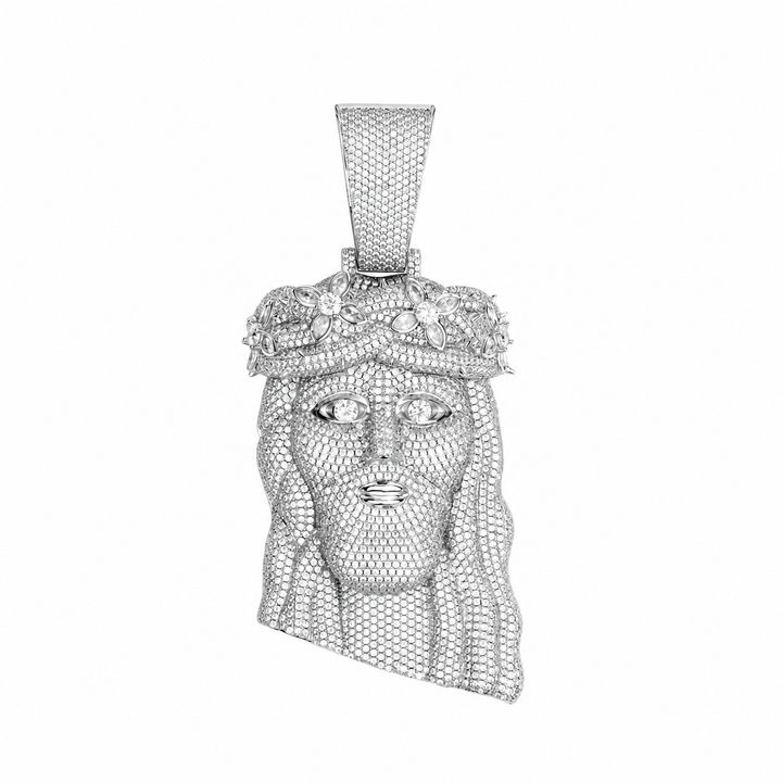 Silver-tone crowned Jesus pendant with stone-set face and tapered bail on white