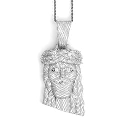 Silver-tone crowned Jesus pendant shown from the front on white