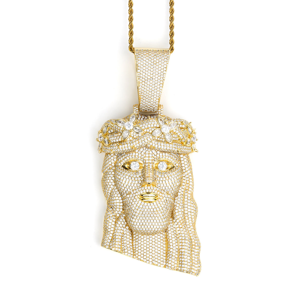 Gold-tone crowned Jesus pendant shown from the front on white