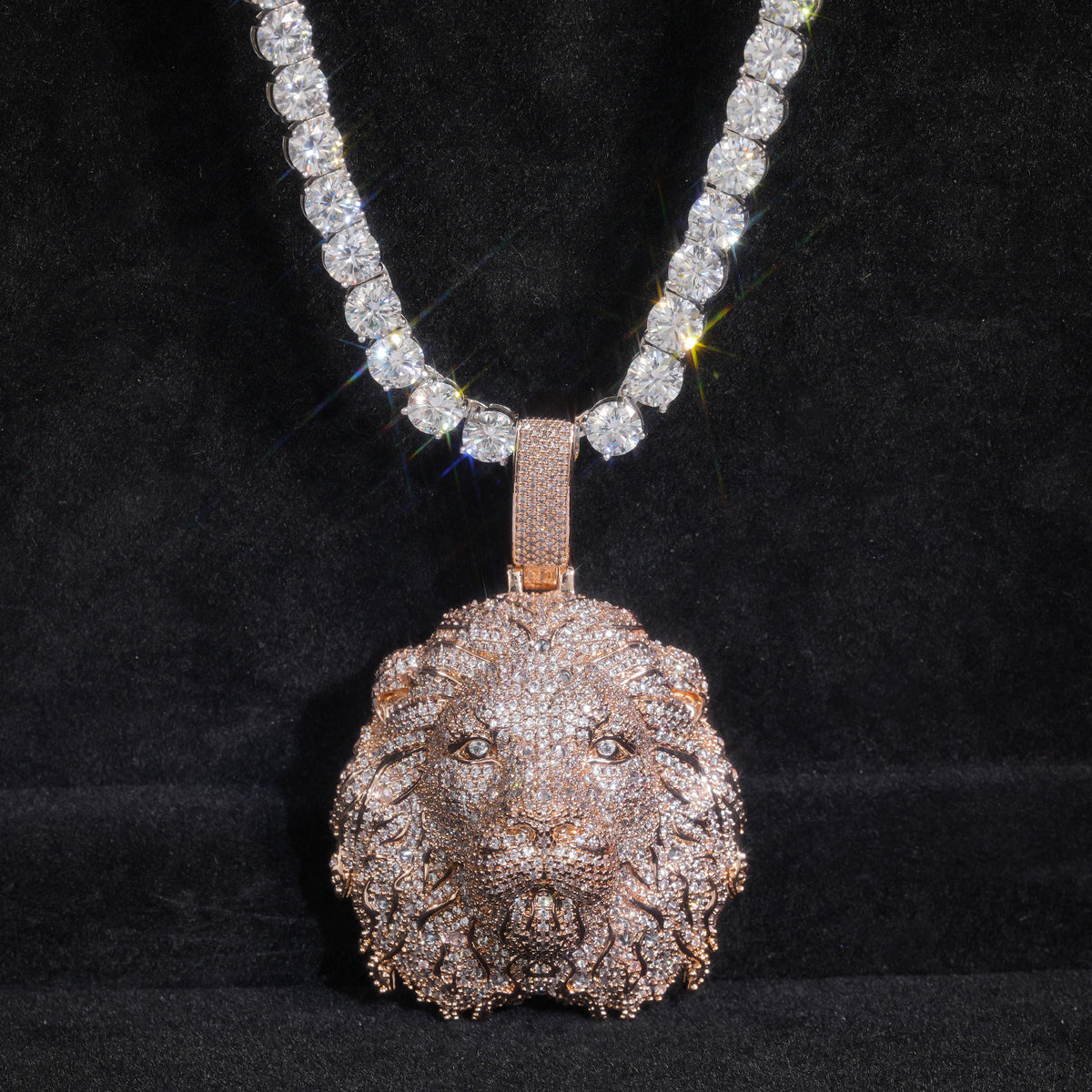 Rose-gold-tone lion head pendant on black fabric