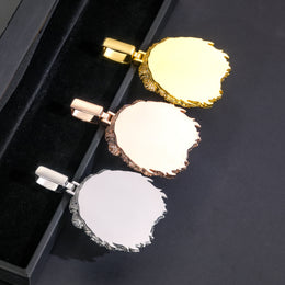 Back views of gold-tone, rose-gold-tone and silver-tone lion head pendants