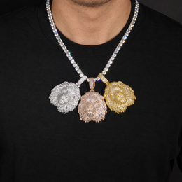 Model wearing silver-tone, rose-gold-tone and gold-tone lion head pendants over a black shirt
