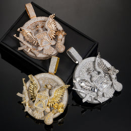 Three eagle medallion pendant finishes on a black display