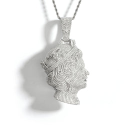 Silver-tone queen portrait pendant with a pavé face and tiara on white