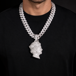 Model wearing a silver-tone iced queen portrait pendant over a black crew-neck shirt