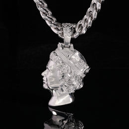 Silver-tone queen portrait pendant showing the polished sculpted side against black