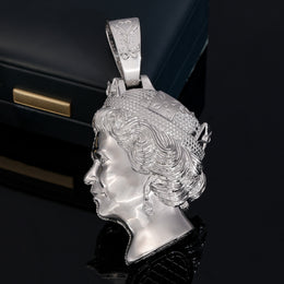 Polished side of the silver-tone queen portrait pendant with tiara and sculpted curls