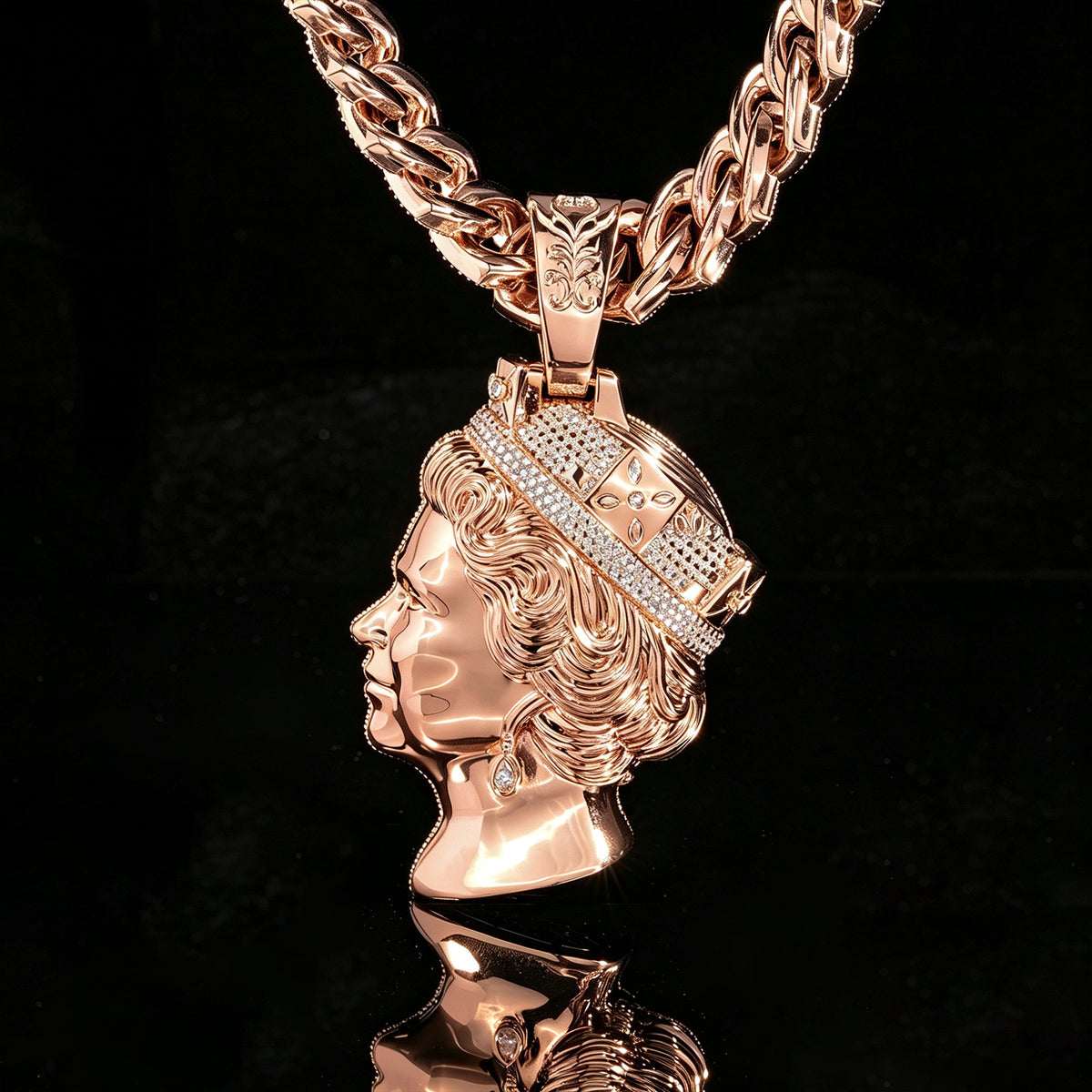 Rose-gold-tone queen portrait pendant showing the polished sculpted side against black