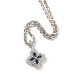 Deep-blue four-leaf clover pendant in a silver-tone setting on white