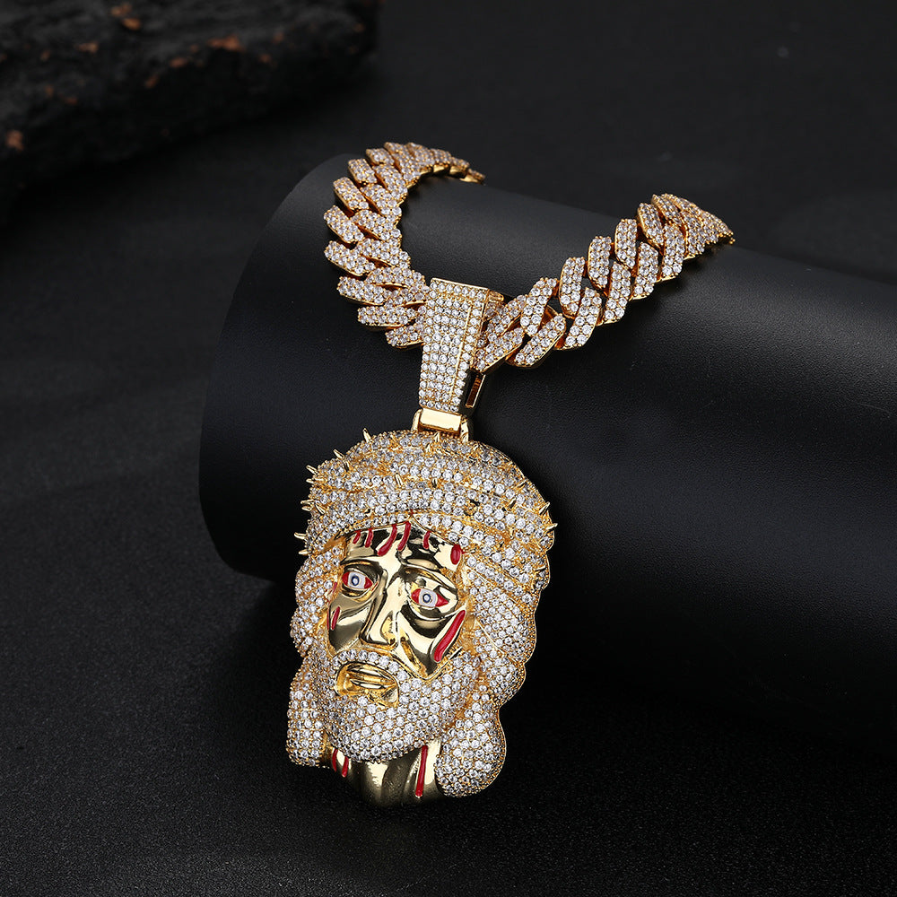 Gold-tone iced Crown of Thorns Jesus pendant on a black display