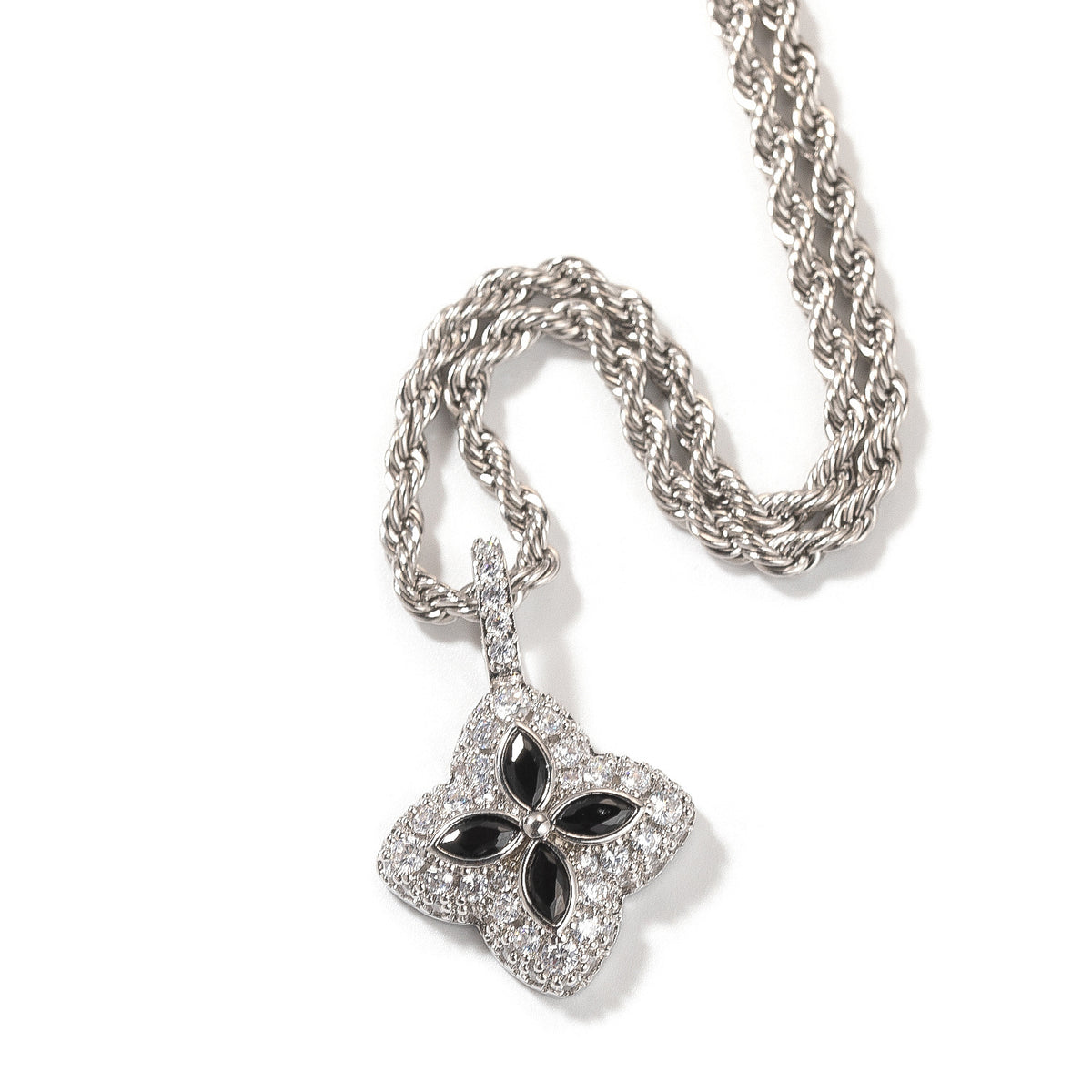 Black four-leaf clover pendant in a silver-tone setting on white