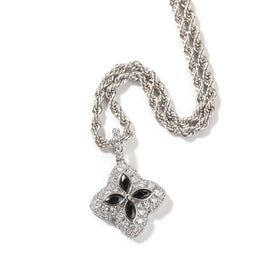 Black four-leaf clover pendant in a silver-tone setting on white