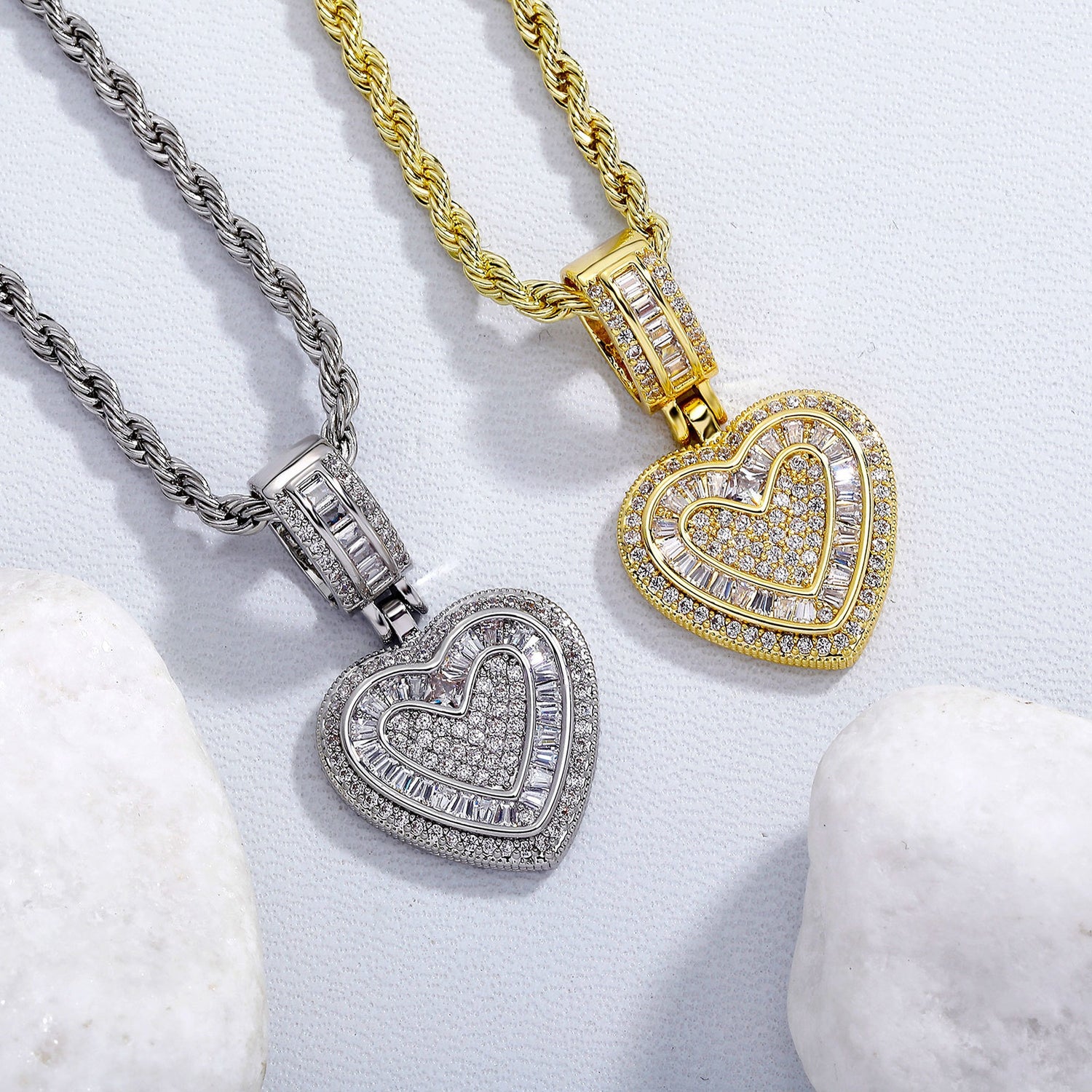Gold and silver baguette iced double heart pendant stone setting detail
