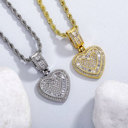 Gold and silver baguette iced double heart pendant stone setting detail