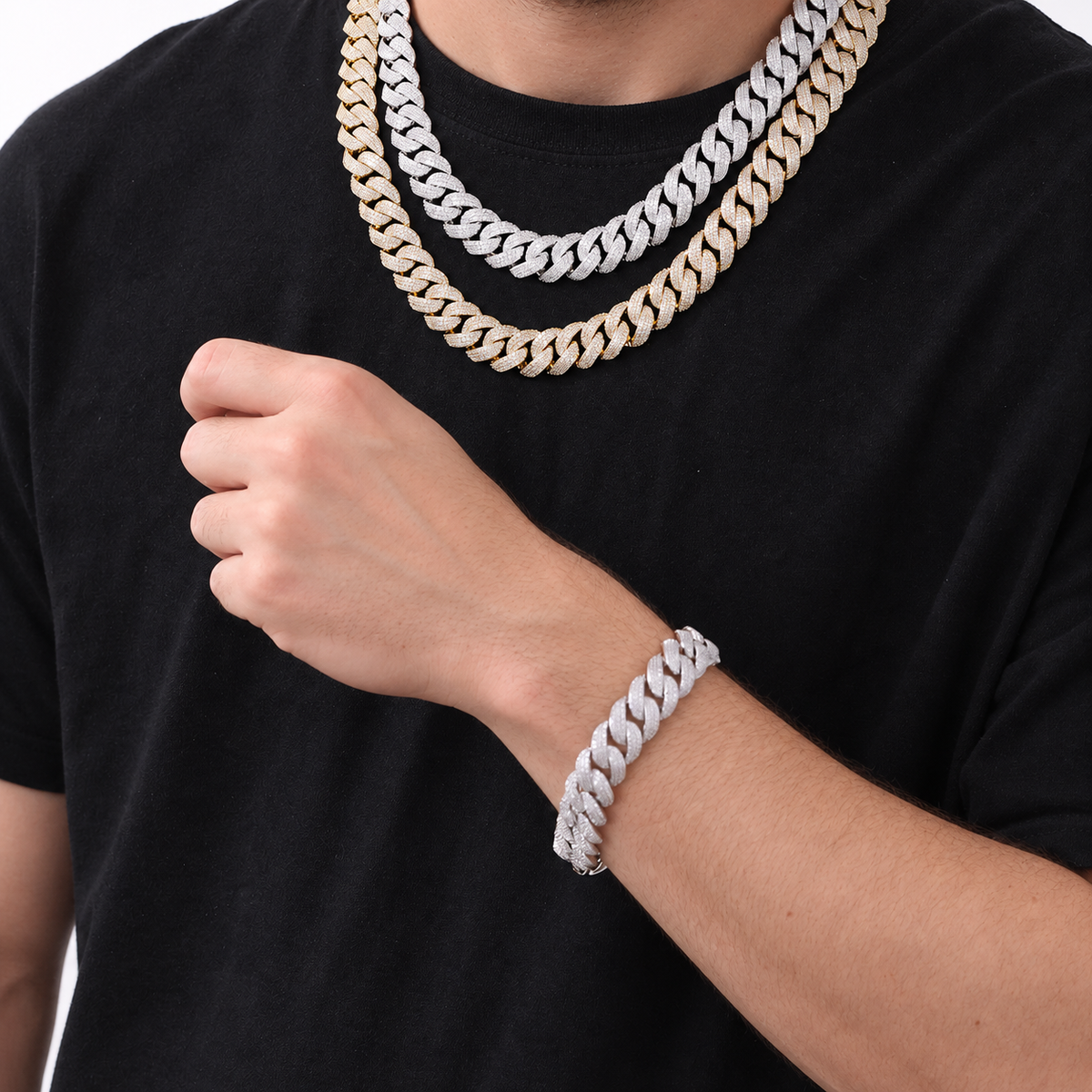 Adult model wearing silver- and gold-tone Cuban chains and a silver-tone Cuban bracelet
