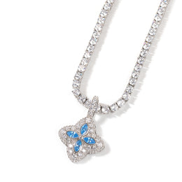 Aqua-blue four-leaf clover pendant styled against a white background