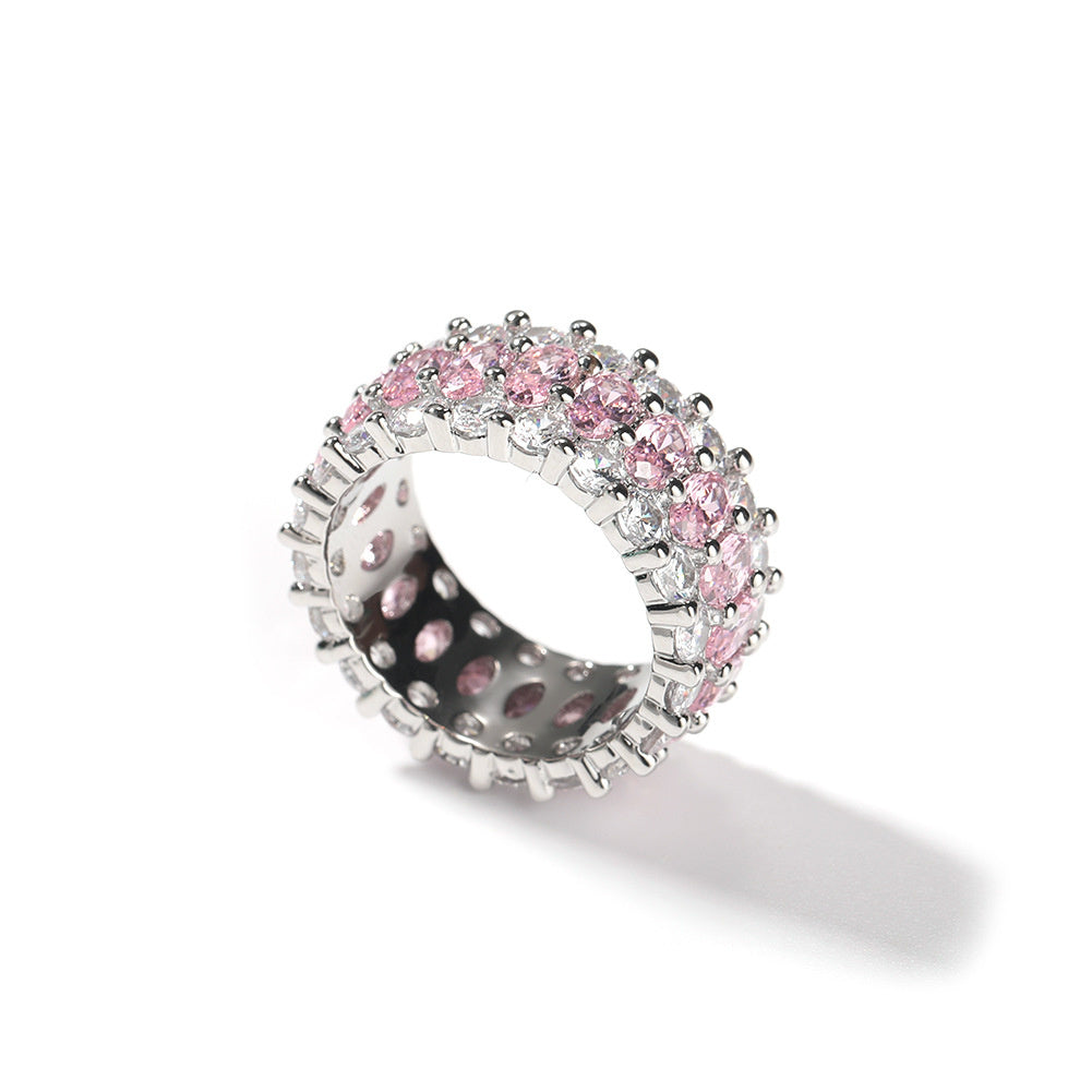 Side view of the pink-stone ring showing its open setting