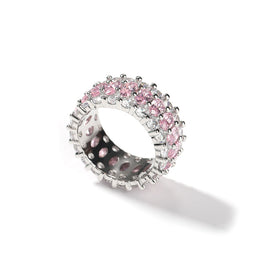 Side view of the pink-stone ring showing its open setting