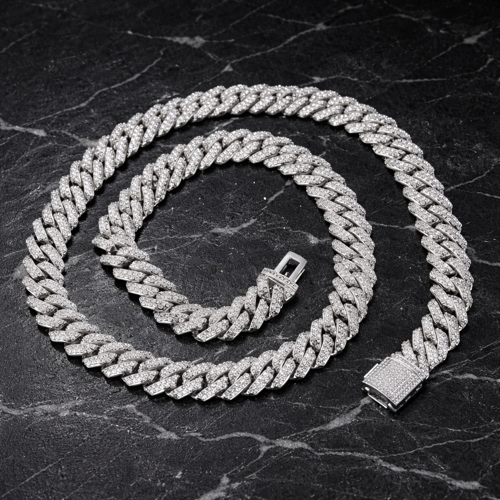 Iced out diamond Cuban link chain on black marble background - Miles Jewellery