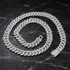 Iced out diamond Cuban link chain on black marble background - Miles Jewellery