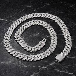 Iced out diamond Cuban link chain on black marble background - Miles Jewellery