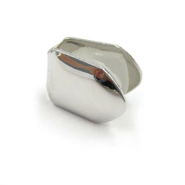 Silver-tone single tooth grill with smooth curved face on white
