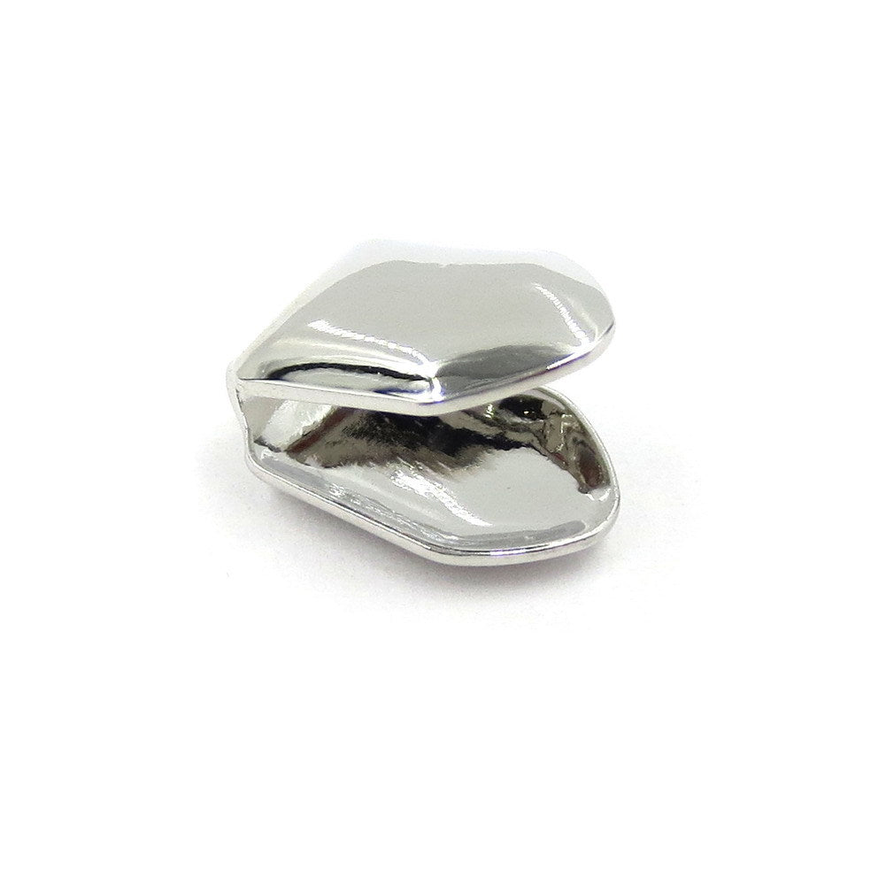 Silver-tone single tooth grill showing the open back and curved rims