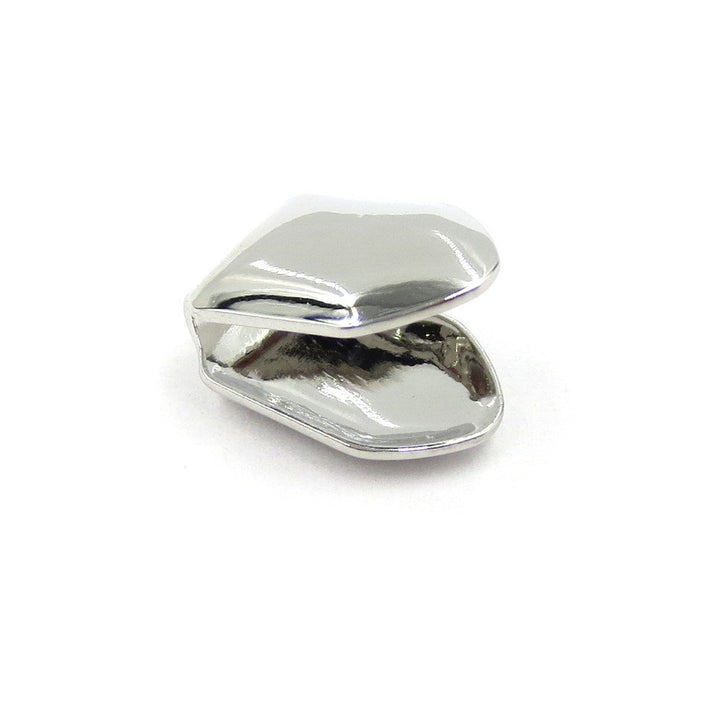 Silver-tone single tooth grill showing the open back and curved rims