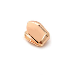 Rose-gold-tone single tooth grill with polished face and curved side