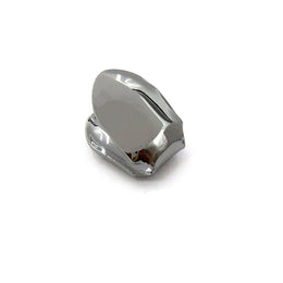 Gunmetal-tone single tooth grill showing the smooth cap and open back
