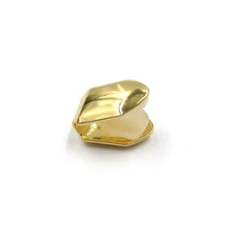 Gold-tone extra thick single tooth grill with the open back visible