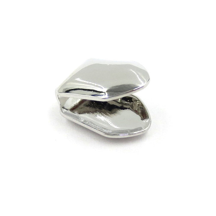 Silver-tone extra thick single tooth grill with the open back visible