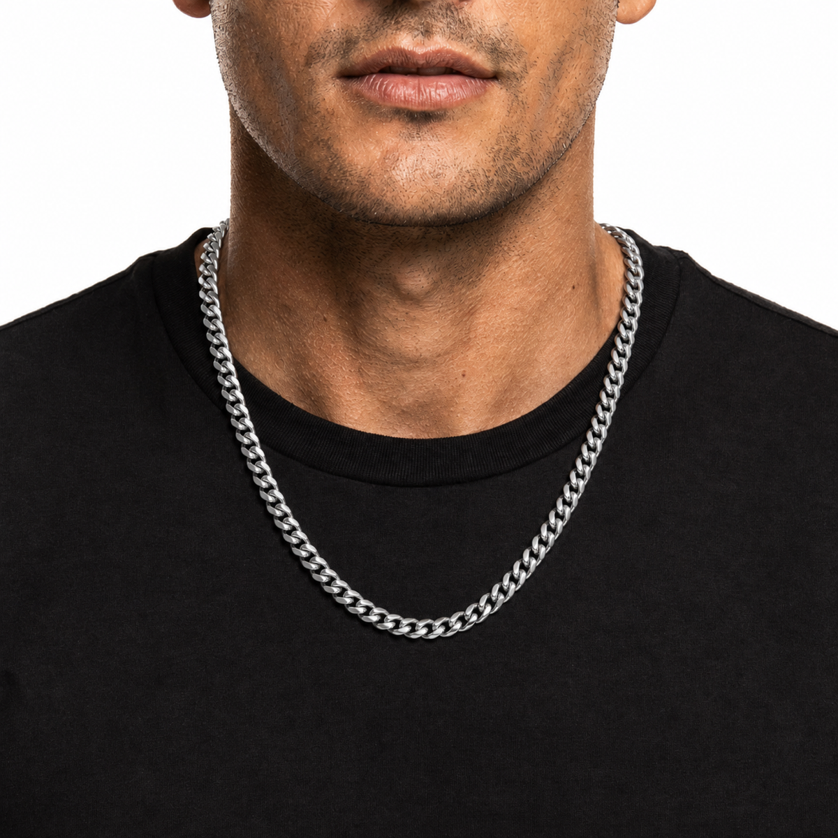 Male model wearing a 6mm stainless steel Miami Cuban chain in silver tone