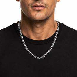 Male model wearing a 6mm stainless steel Miami Cuban chain in silver tone