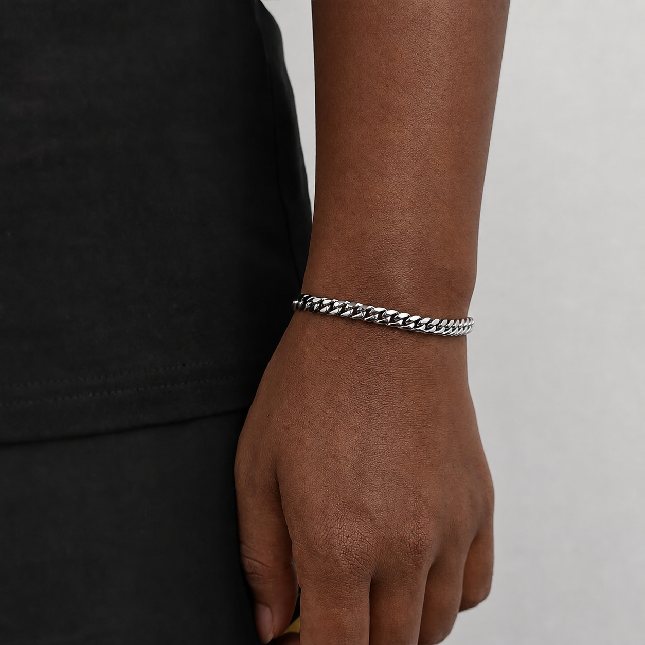 6mm steel Miami Cuban link bracelet on natural deep brown skin