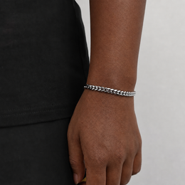 6mm steel Miami Cuban link bracelet on natural deep brown skin